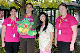 “Smiles” group in pink (L to R) Nicole Lederman, Emma Catherwood, Samantha Privratsky. Jeanie Ruiz (registered dental assistant) is third from left
