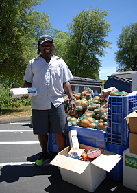 A Redwood Empire Food Bank volunteer delivering senior food boxes in Willits.